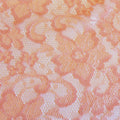A flat sample of nadia scalloped stretch lace in the color blush.