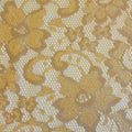 A flat sample of nadia scalloped stretch lace in the color nude.