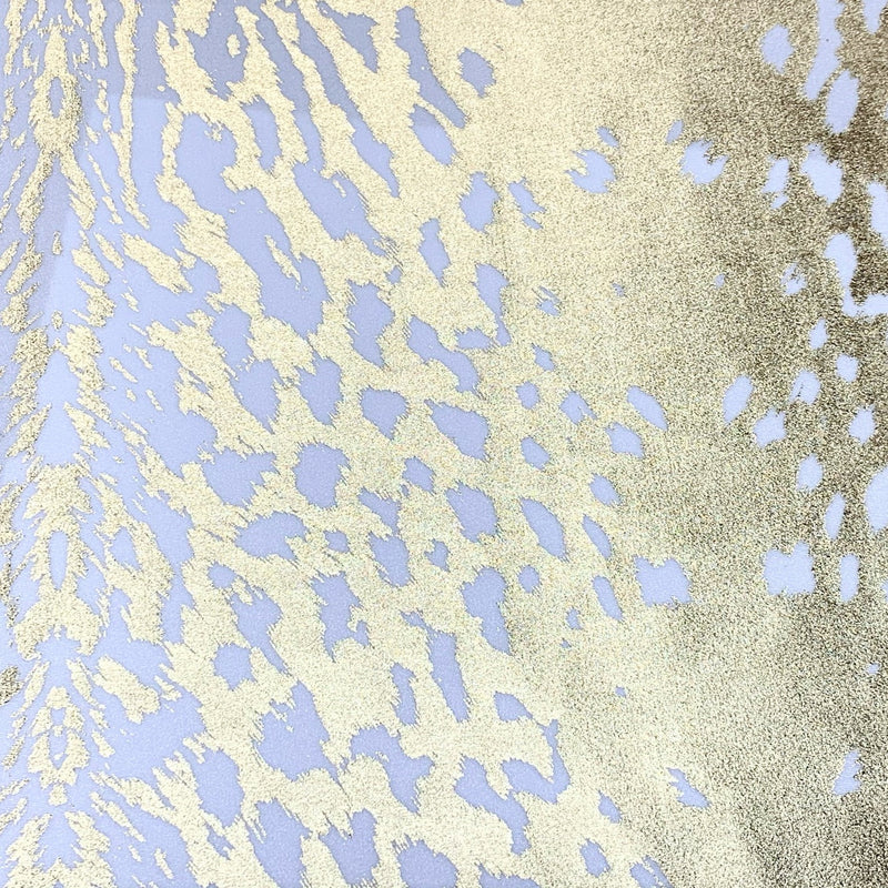 A flat sample of naga foil printed spandex in the color white/gold.