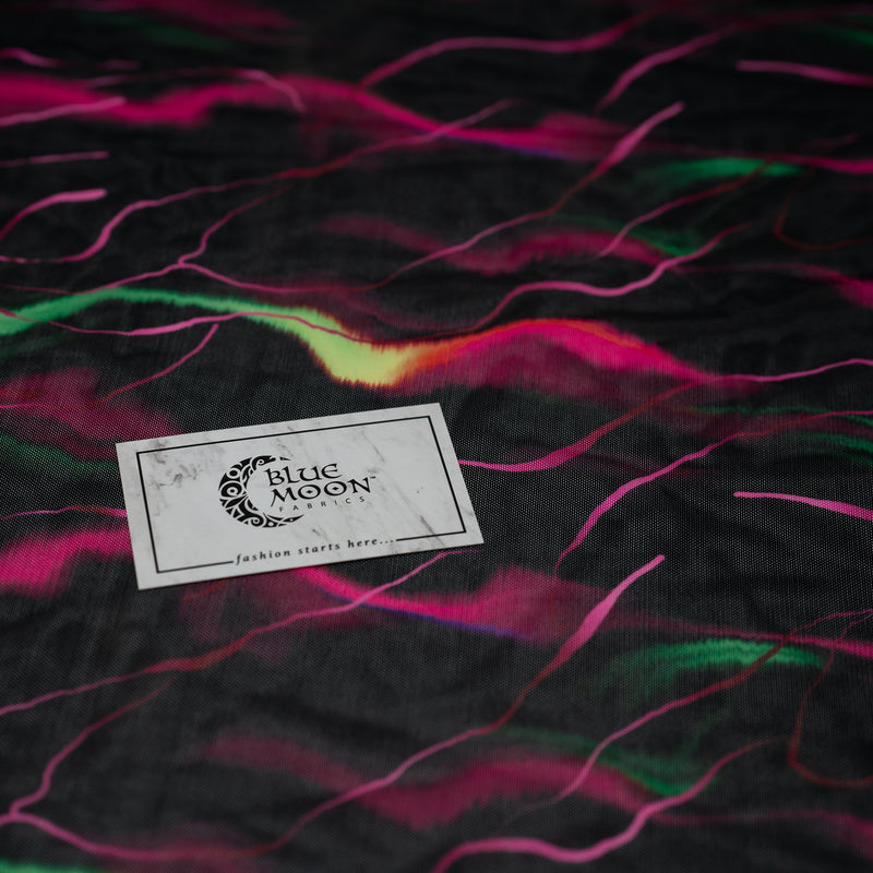 Detailed shot of Neon Northern Lights Printed Power Mesh with Blue Moon Fabrics logo