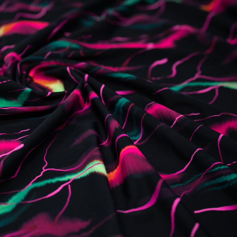 A swirled piece of Neon Northern Lights Printed Spandex
