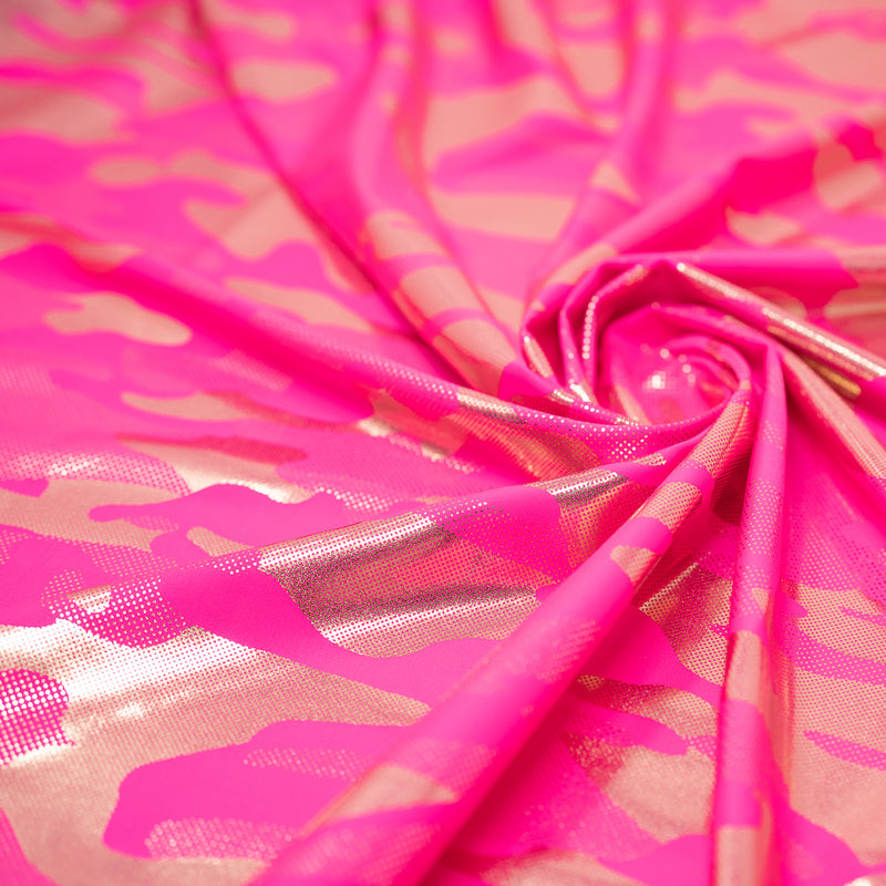 Detailed shot of Neon Nugi Foil Printed Cationic Spandex in color Fluorescent Pink Gold.