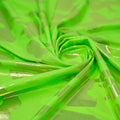 Detailed shot of Neon Nugi Foil Printed Cationic Spandex in color Neon Lime Gold.