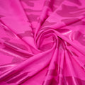 A swirled sample of Nugi Foil Printed Spandex in Hot Pink/Baby Pink.