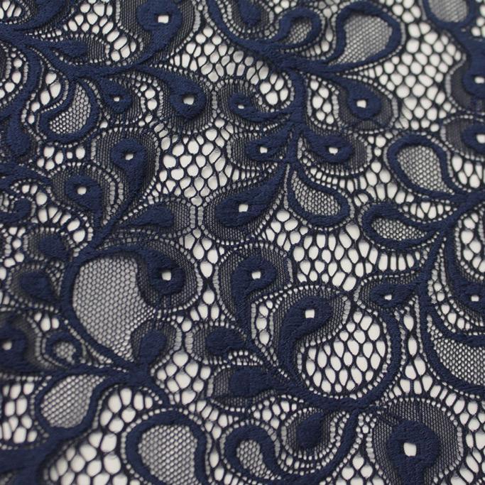 A falt sample of olivia stretch lace in the color navy.