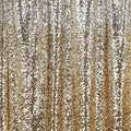 A draped sample of ombre stretch mesh sequin in the color silver-gold.