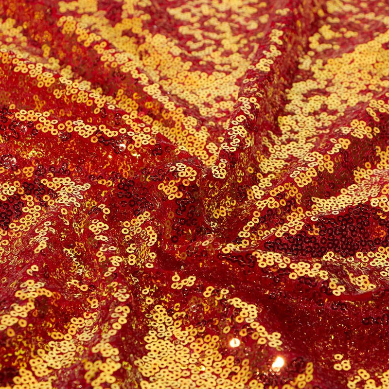 A swirled sample of opulence stretch mesh sequin in the color red-iridescent opal.