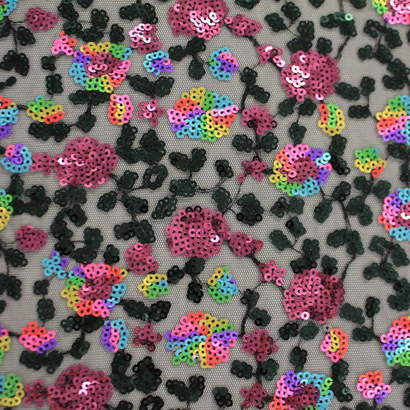 A flat sample of paradise embroidered mesh sequin.