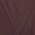 A pleated piece of performance nylon spandex fabric in the color cappuccino.