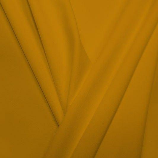 A pleated piece of performance nylon spandex fabric in the color medallion yellow.