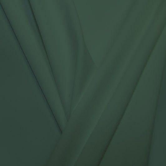 A pleated piece of performance nylon spandex fabric in the color pale cacti.