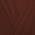 A pleated piece of performance nylon spandex fabric in the color warm pinecone.
