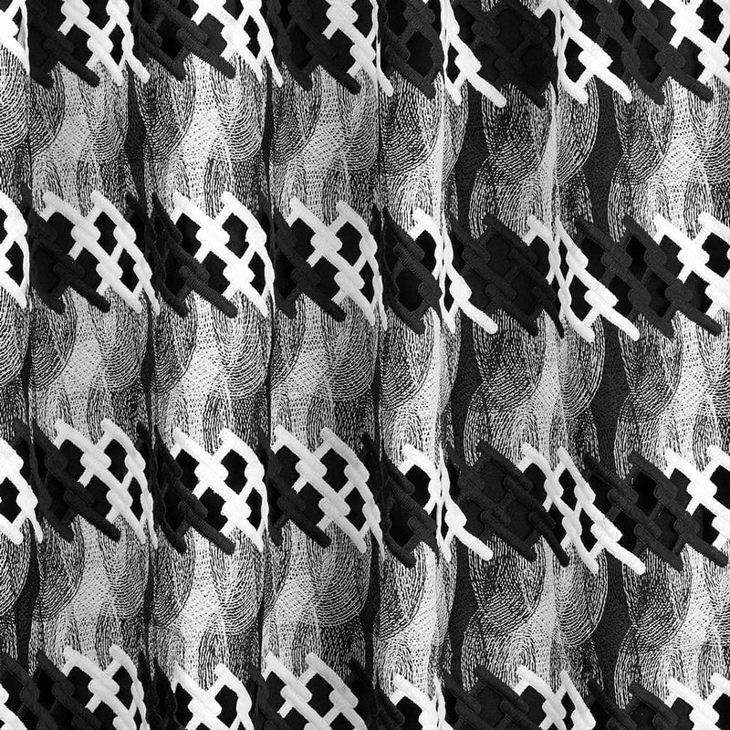 A draped sample of pixel mechanical lace in the color black-white.