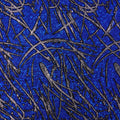 A flat sample of pollock shttered glass foiled spandex in the color royal blue.