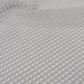 A swirled sample of pop mesh stretch netting in the color white.