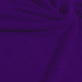 A swirled sample of popcorn polyester spandex jacquard in the color dark purple.