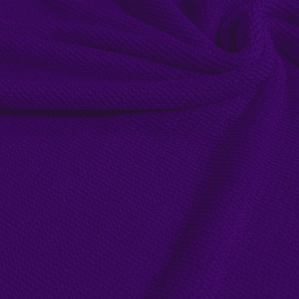 A swirled sample of popcorn polyester spandex jacquard in the color dark purple.