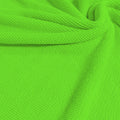 A swirled sample of popcorn polyester spandex jacquard in the color electric lime.
