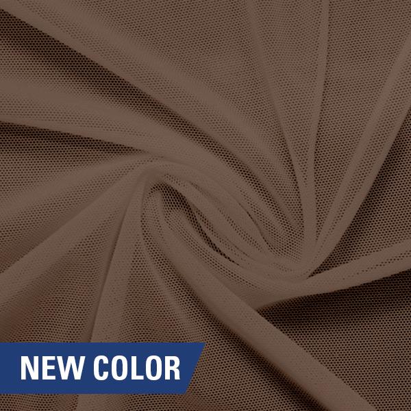 A swirled piece of nylon spandex power mesh in the color bashful.