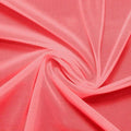 A swirled piece of nylon spandex power mesh in the color blossom pink.