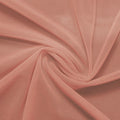 A swirled piece of nylon spandex power mesh in the color Blush