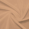 A swirled piece of nylon spandex power mesh in the color caramel kiss.