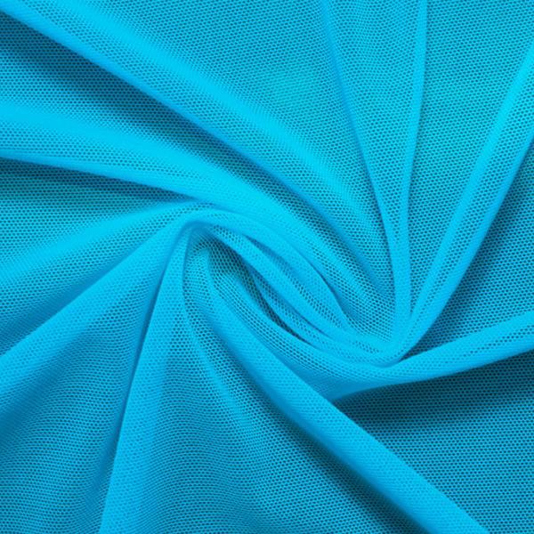 A swirled piece of nylon spandex power mesh in the color celeste blue.