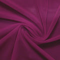 A swirled piece of nylon spandex power mesh in the color dark berry.