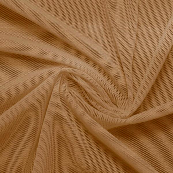 A swirled piece of nylon spandex power mesh in the color dark nude.