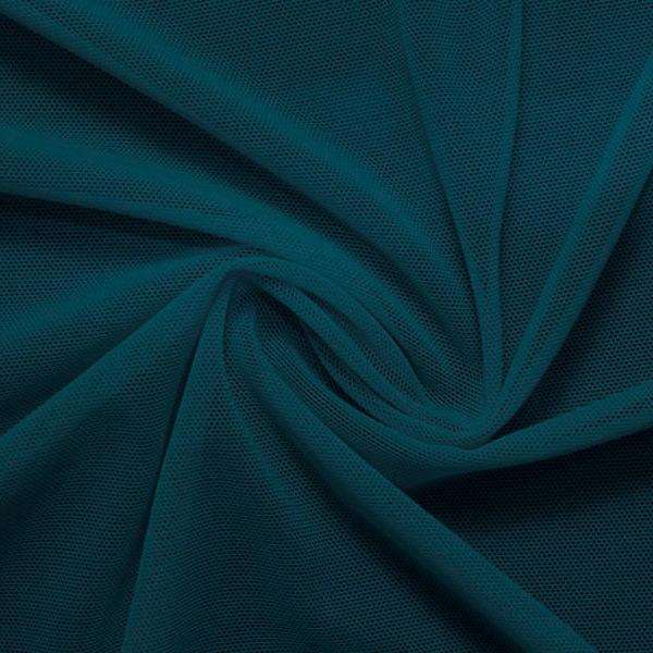 A swirled piece of nylon spandex power mesh in the color fiji.