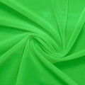A swirled piece of nylon spandex power mesh in the color grasshopper.