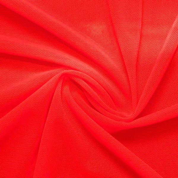 A swirled piece of nylon spandex power mesh in the color hot coral.