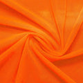 A swirled piece of nylon spandex power mesh in the color juicy tangerine.