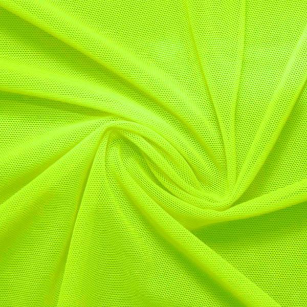 A swirled piece of nylon spandex power mesh in the color lemon lime.