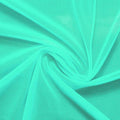 A swirled piece of nylon spandex power mesh in the color menthol.