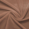 A swirled piece of nylon spandex power mesh in the color mocha.
