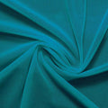 A swirled piece of nylon spandex power mesh in the color new jade.