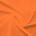 A swirled piece of nylon spandex power mesh in the color outrangeous orange.