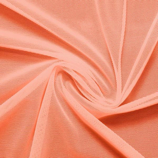 A swirled piece of nylon spandex power mesh in the color peach.
