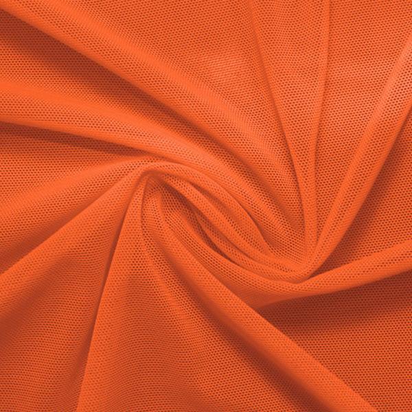 A swirled piece of nylon spandex power mesh in the color penny.