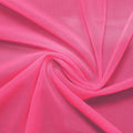 A swirled piece of nylon spandex power mesh in the color pink panther.