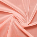 A swirled piece of nylon spandex power mesh in the color salmon.