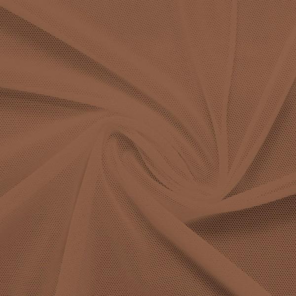 A swirled piece of nylon spandex power mesh in the color sweet syrup.