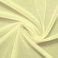 A swirled piece of nylon spandex power mesh in the color yellow.