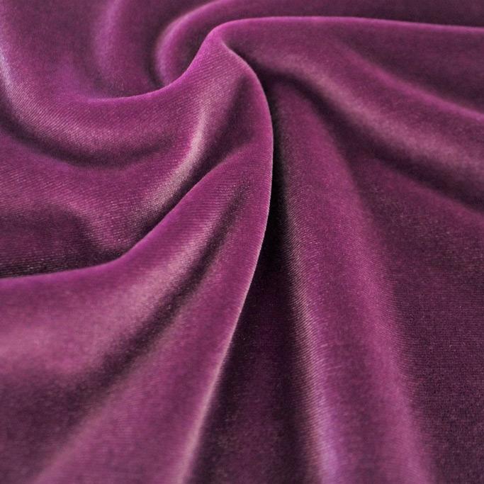 A swirled sample of primo stretch velvet in the color magenta.