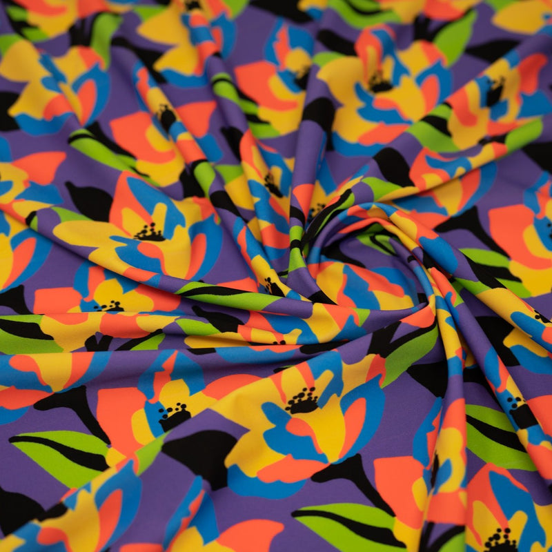 Swirled piece of Abstract Painted Lilies Printed Spandex in Multi Color.