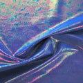A swirled sample of prismatic foiled spandex in the color royal blue.