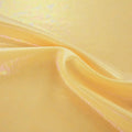 A swirled sample of popcorn polyester spandex jacquard in the color sunshine yellow.