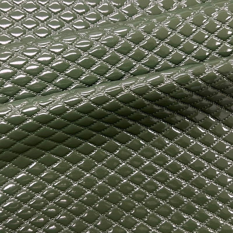 A sample of quilted hipster polyurethane coated spandex in the color Forest Green