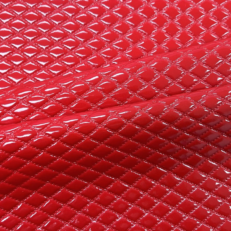 A sample of quilted hipster polyurethane coated spandex in the color red